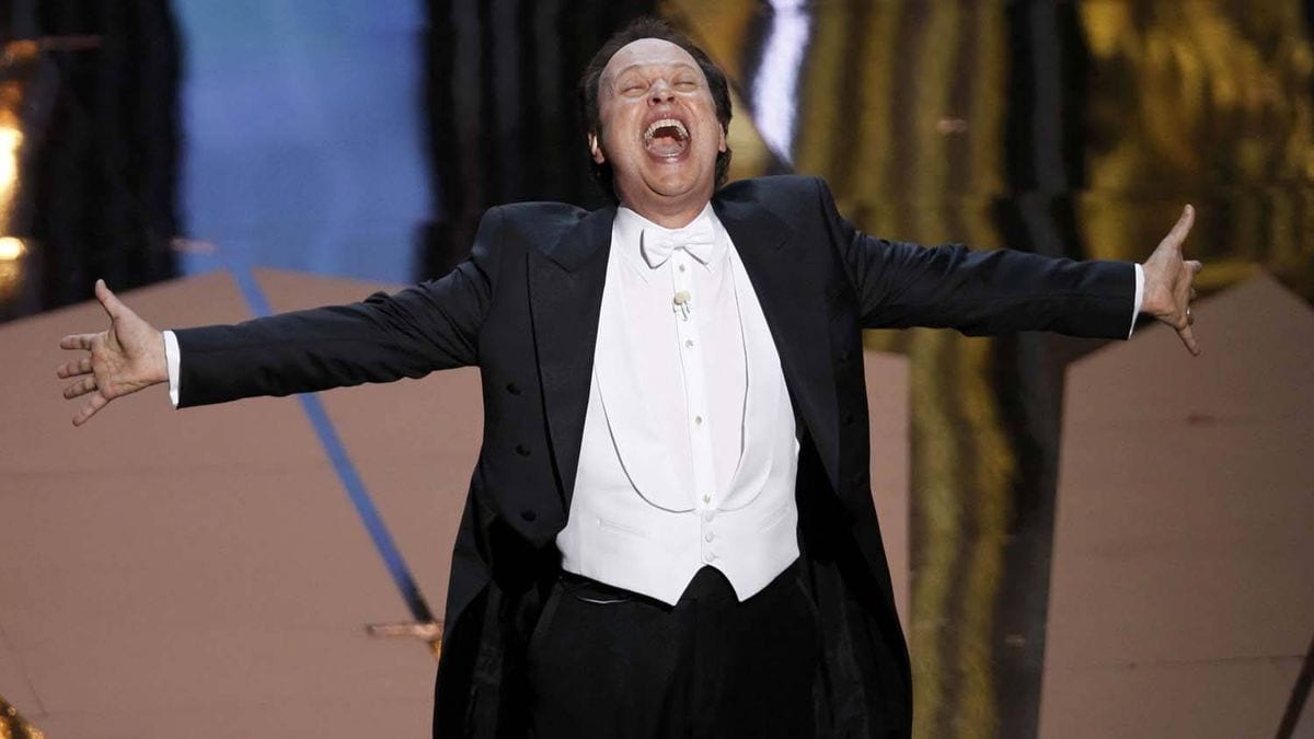 Host Billy Crystal performs onstage during the 84th Annual Academy Awards in 2012.