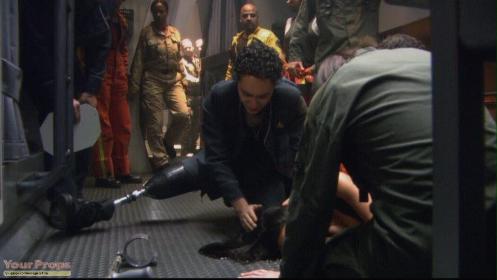 A hobbled Lt. Gaeta (Alessandro Juliani) finds Lt. Dualla (Kandyse McClure) after her suicide in Battlestar Galactica