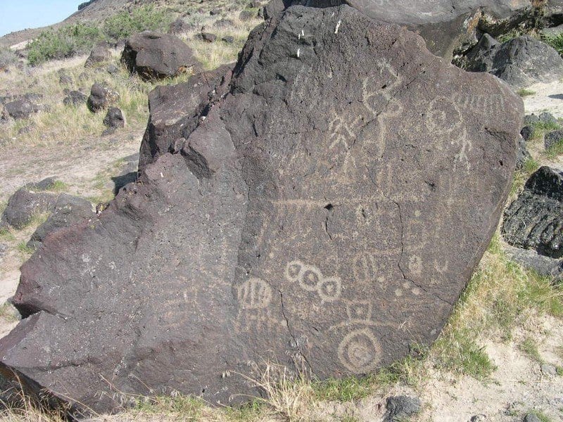 symbols drawn on a rock similar to the owl cave map