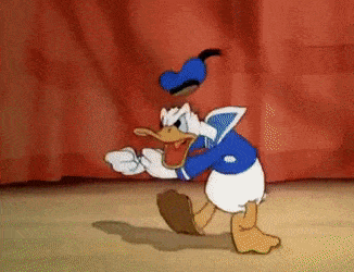 donald duck being hooked off stage and an audience full of mice laughing