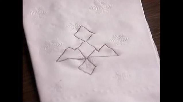 two triangle images combined drawn on a napkin