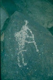 Image of the kokopelli carved into a rock