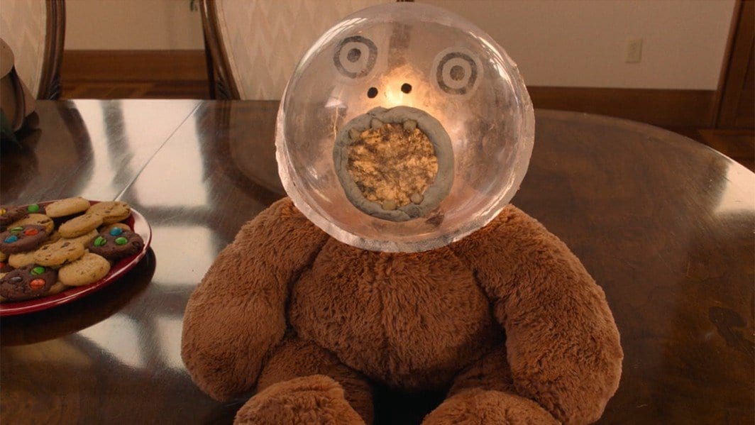 Johnny Horne's teddy with a glass orb head and a golden pool for a mouth with teeth