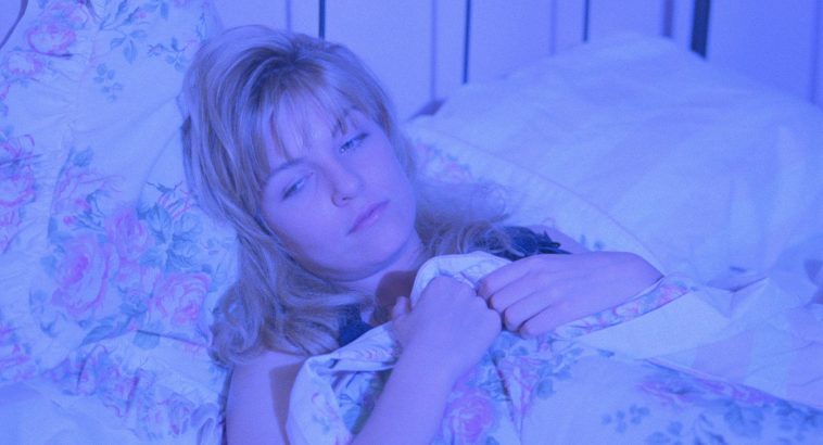 Laura Palmer in bed dreaming bathed in blue light