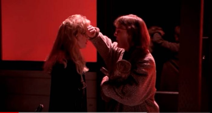 The Log Lady puts her hand to Laura's forehead