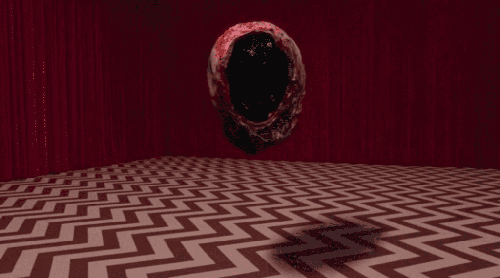 a circular nugget with black insides floating in the black lodge