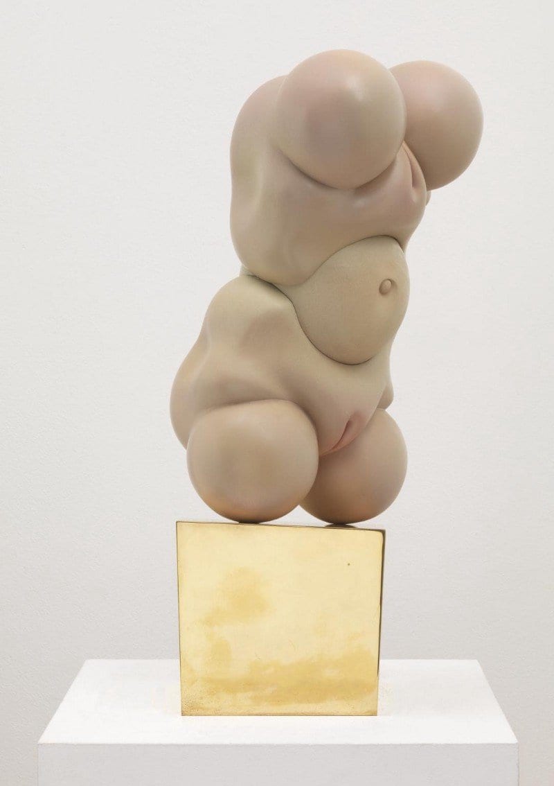 sculpture of two female groins and a belly