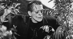 Frankenstein's monster looks through the trees