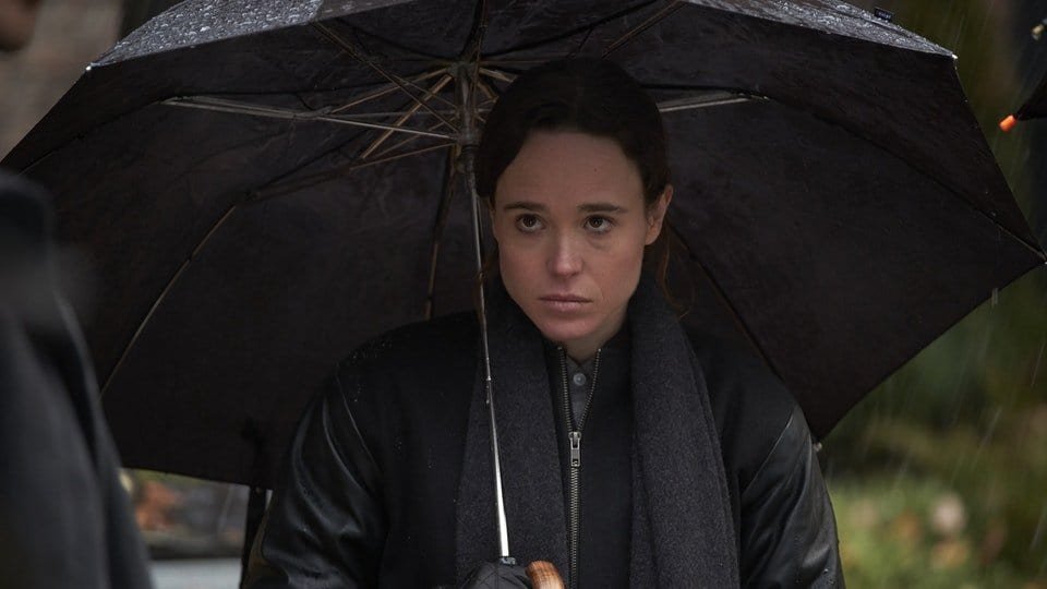 Ellen Page as Vanya Hargreeves standing under an umbrella