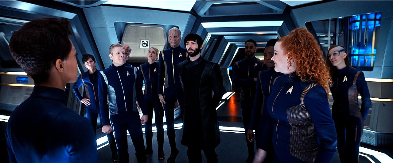 The crew of the USS Discovery stands united with Michael Burnham (Sonequa Martin-Green) in Star Trek: Discovery Season 2 episode 13 - "Such Sweet Sorrow"