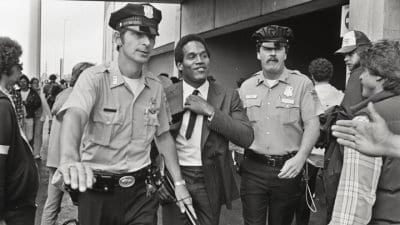 O.J. Simpson escorted by police in an image from the ESPN 30-for-30 documentary O.J.: Made in America