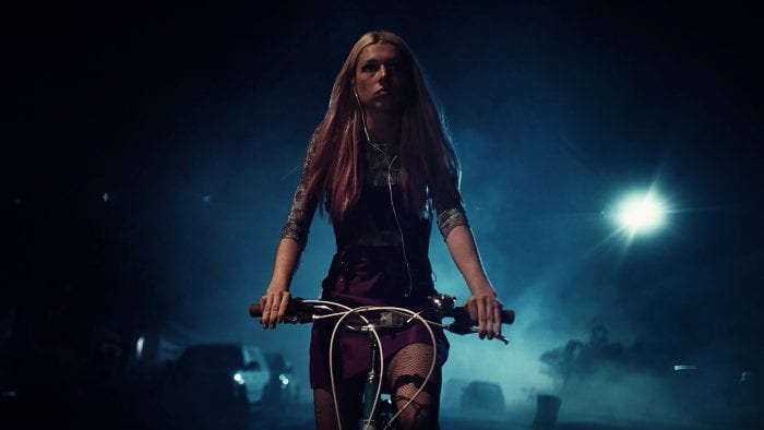 Jules rides her bike at night in HBO's Euphoria