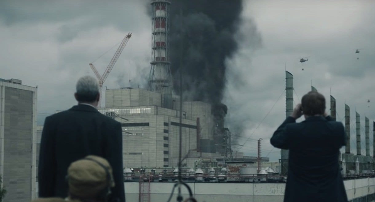 Legasov and Shcherbina watch helicopters attempt to put out the fire at the Chernobyl power plant