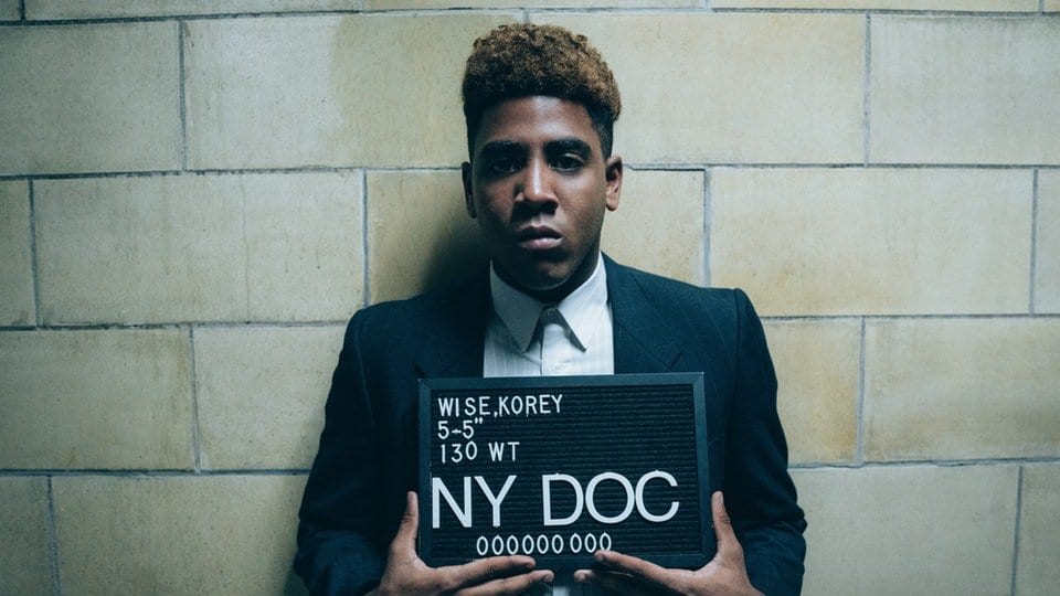 Korey Wise (Jharrel Jerome) poses for his mug shot in Netflix's When They See Us