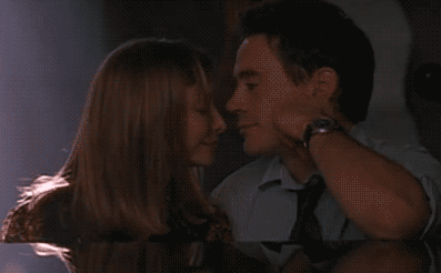 Ally McBeal and Larry Paul sharing a tender moment GIF