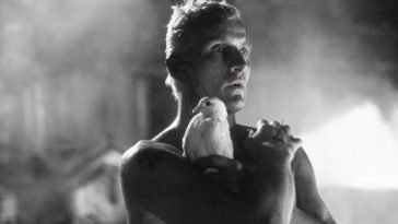 Rutger Hauer as Roy Batty in Blade Runner clutching a dove in his arms in the rain