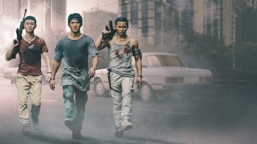 Triple Threat Netflix image of 3 men walking down a dusty street carrying weapons