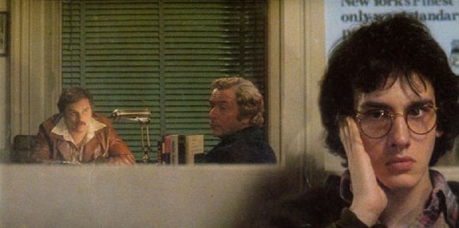 Two middle-aged men talk to each other in a detective's office in the background, while a teenage boy eavesdrops in the foreground.