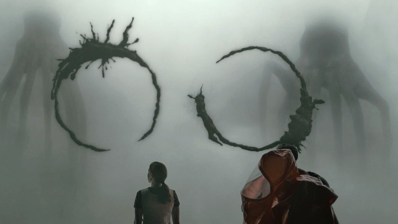 People look on as the aliens make circular patterns in the air in Arrival