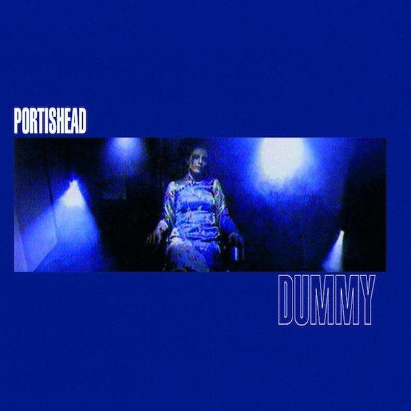 The cover of Portishead's Dummy is mostly blue, with a narrow widsceen picture cutting through the center of singer Beth Gibbons looking highly enigmatic.