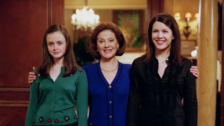 Emily puts her arms around Rory and Lorelai