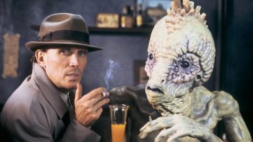 William Lee (Peter Weller) shares a smoke and a drink with a Mugwump in David Cronenberg's Naked Lunch (1991)