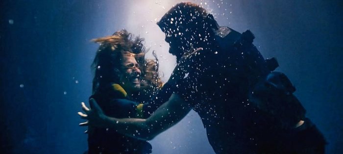 Alien Yalalia and human officer Captain Shade engage in underwater combat