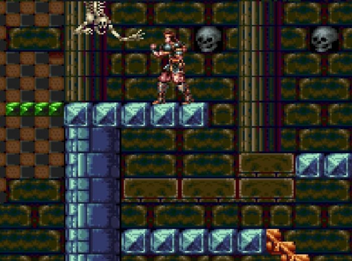 A goofy looking skeleton torso paws at you while skulls embedded in the wall watch.
