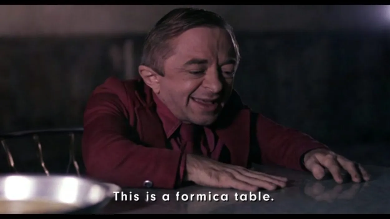 the arm shows bob his formica table