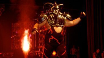 Big Van Vader walks to the ring in his ceremonial mask, as pyro pops behind him