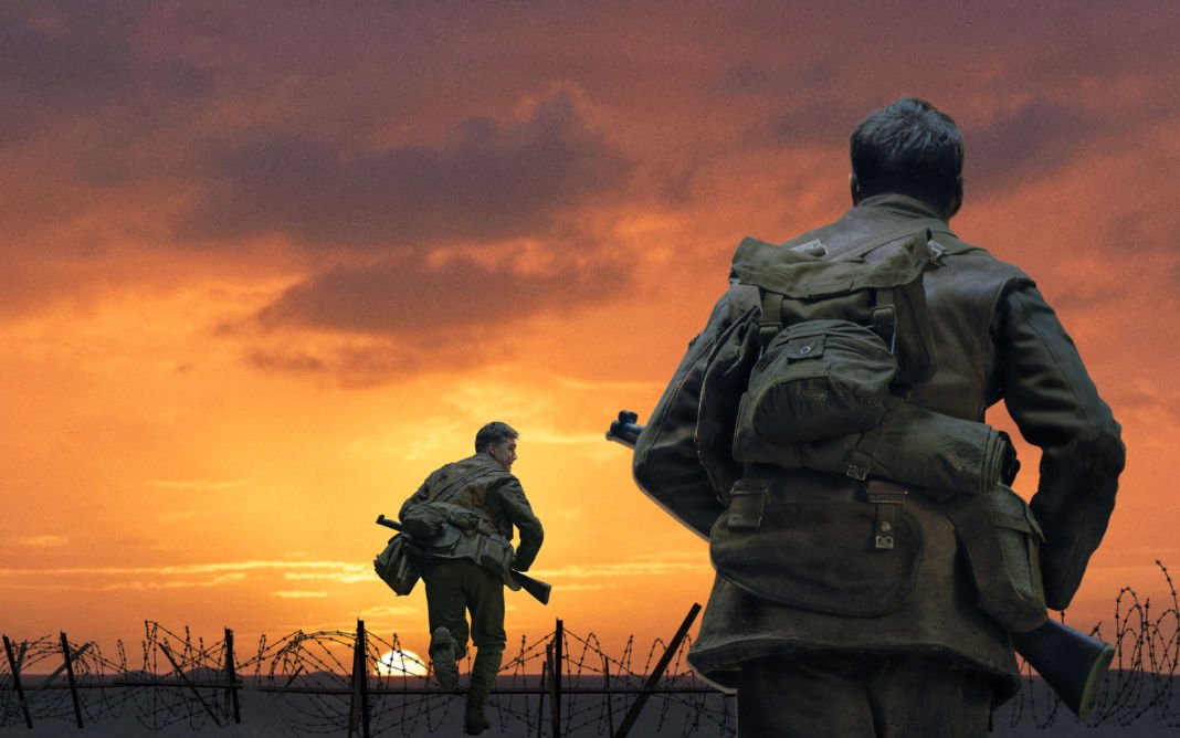2 soldiers running through a field with a purple-orange sky in front of them