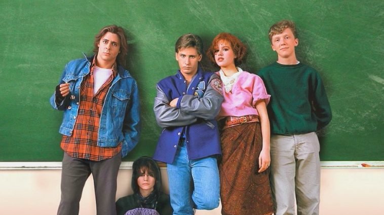 John Bender, Claire Standish, Andrew Clark, Brian Johnson and Allison Reynolds pose against a chalkboard in a school classroom