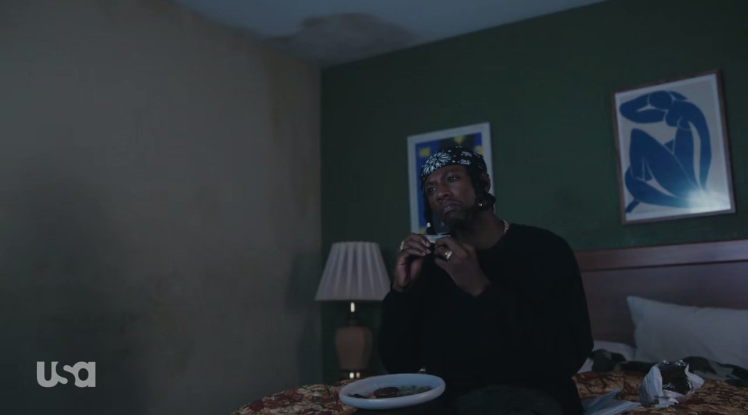 Leon rolls a joint in a motel