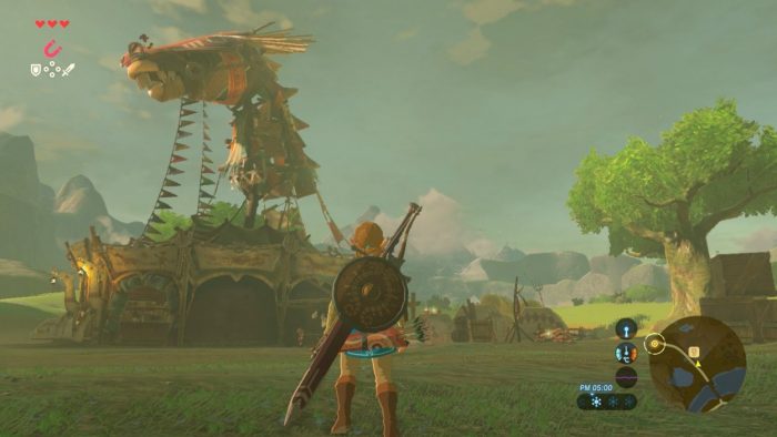 Link stands in front of a horse stable.