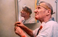 William S. Burroughs acts out a scene from Naked Lunch in Burroughs: The Movie