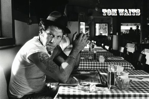 Tom Waits in Blac and White at a cafe table