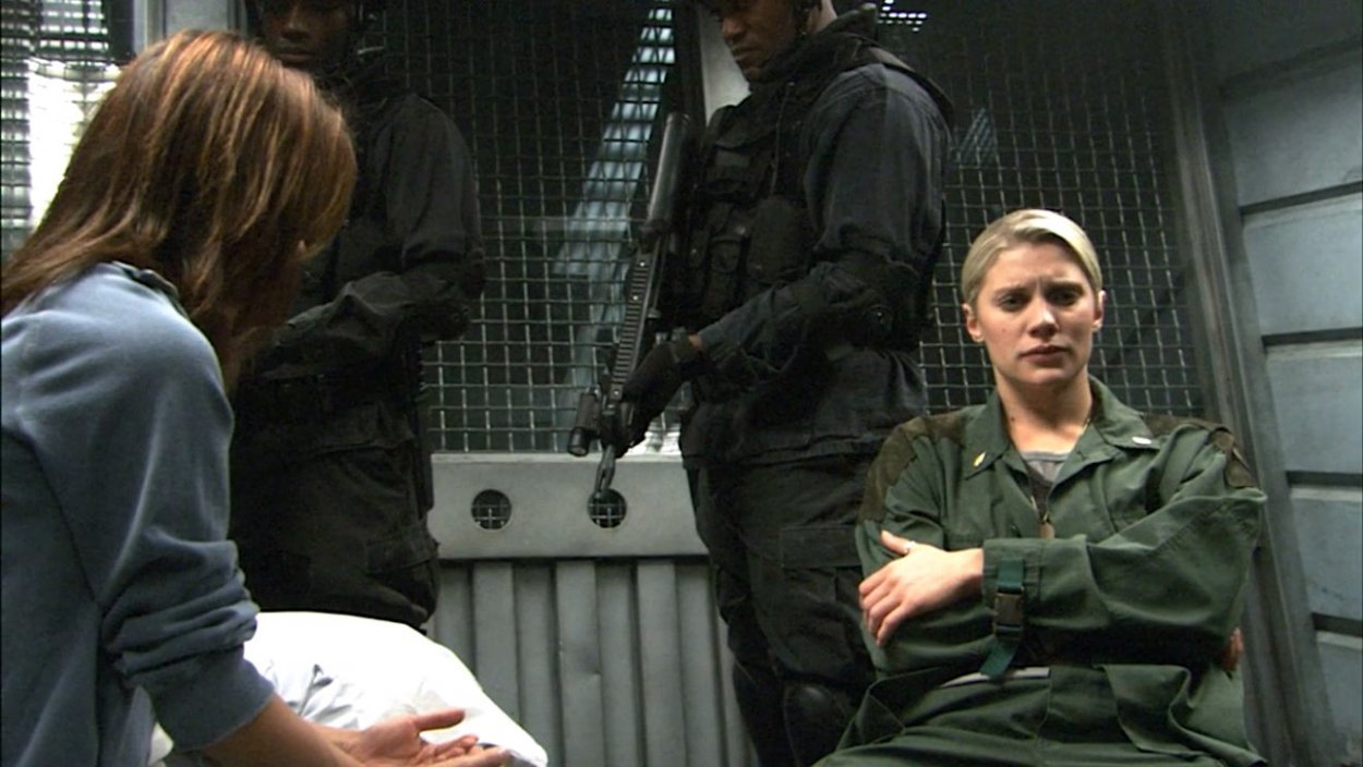 Sharon talks to Starbuck about Scar in the Galactic brig under armed guard