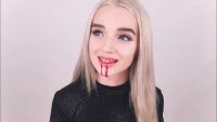 Poppy with blood coming out of her mouth in one of her early disturbing YouTube videos