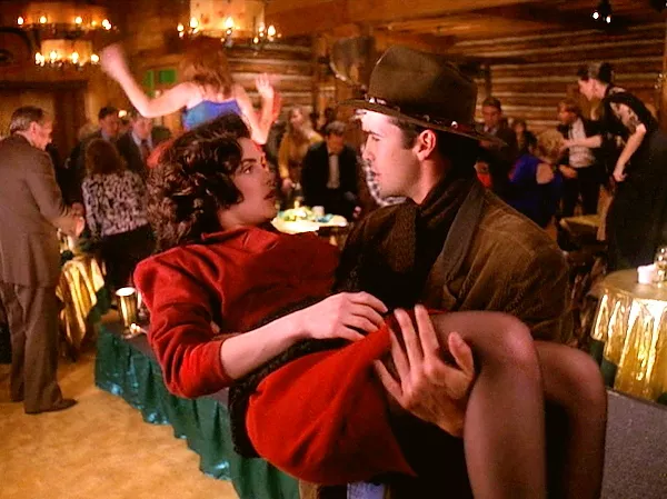 Audrey Horne falls into the arms of John Justice "Jack" Wheeler as the Pine Weasel runs amuck