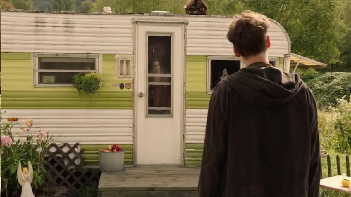 Twin Peaks Part 10 - Richard stands facing Miriam's trailer, his face reflected over hers in the trailer door