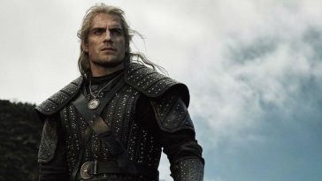 Geralt (Henry Cavill) stands on a cliff, looking into the distance.