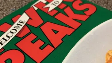 Angled close-up of the Access Guide front cover, text mostly visible on the left, and some pie crust on the bottom right