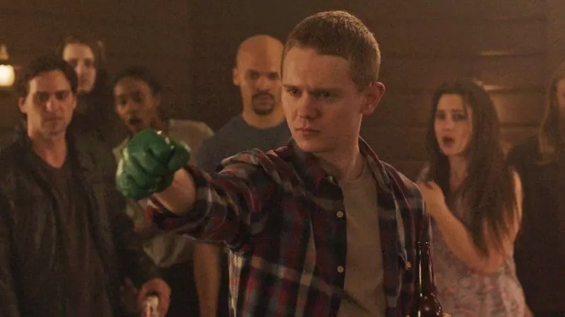 Freddie’s arm is outstretched, showing the green glove he just clobbered some jerk with.