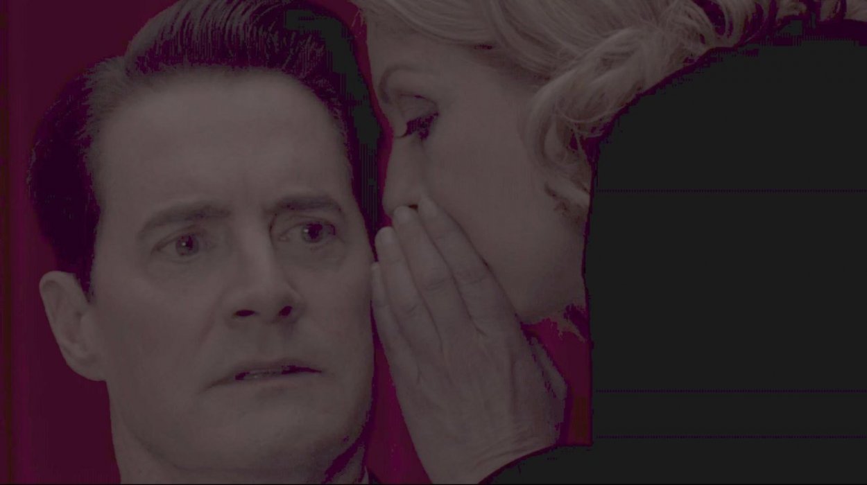 Laura Palmer (right) whispers enigmatically in Dale Cooper's ear