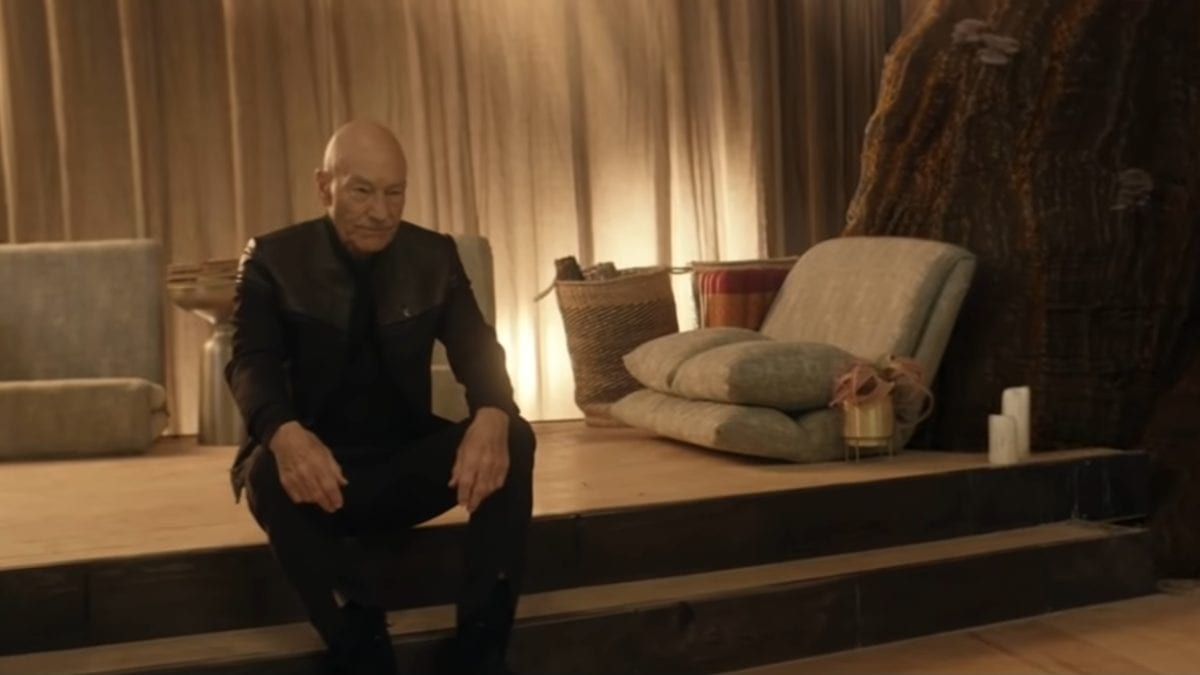 Picard S1E4 - Picard sits on a raised step in a monistary setting