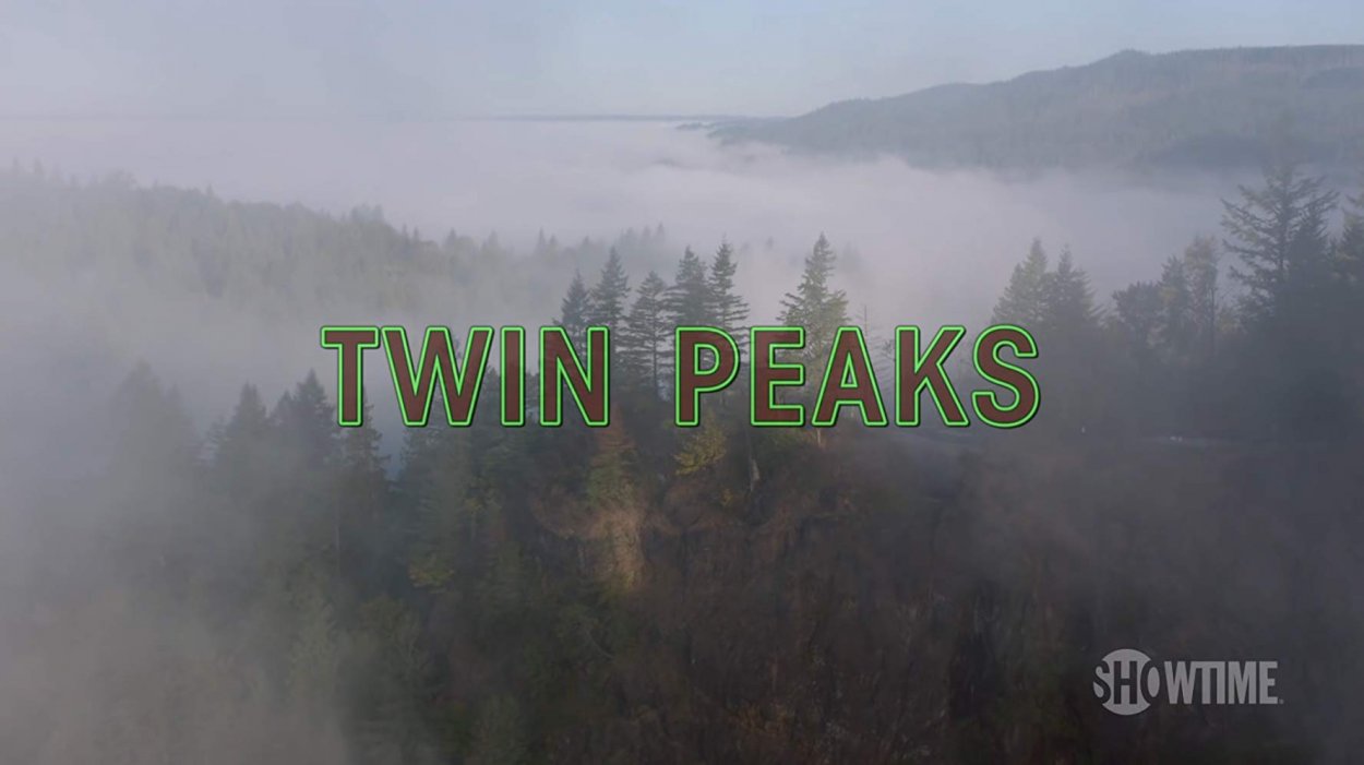 Overhead shot of mountain forest, with Twin Peaks logo superimposed