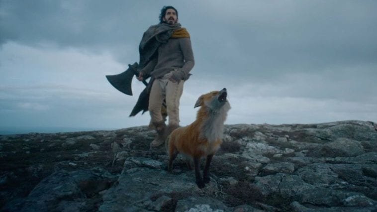 Sir Gawain and his fox walk on a rocky surface