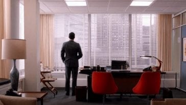 Don Draper stares out his office window