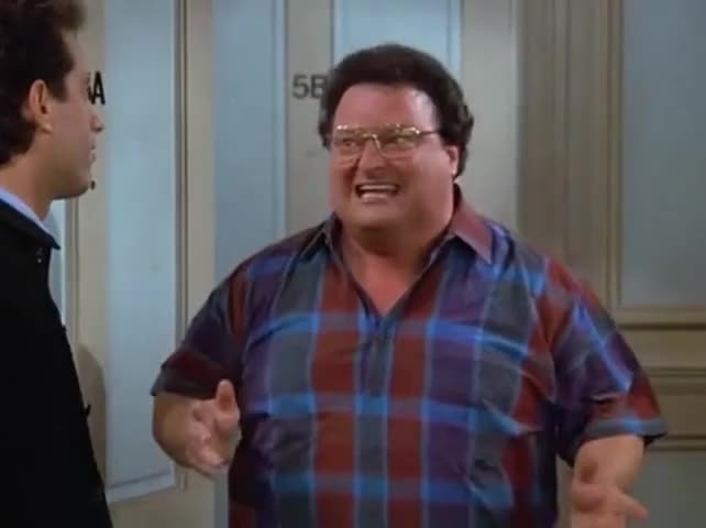 Newman standing in Jerry's doorway
