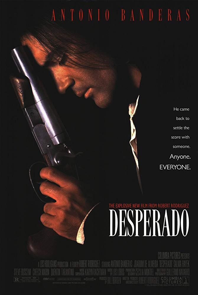 Antonio Banderas in profile resting the barrel of a gun on his forehead in theatrical poster of "Desperado"